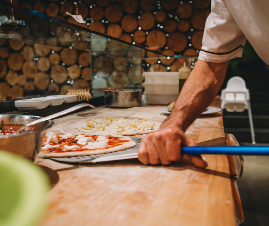 Coralliance member making pizza in his own restaurant kitchen.