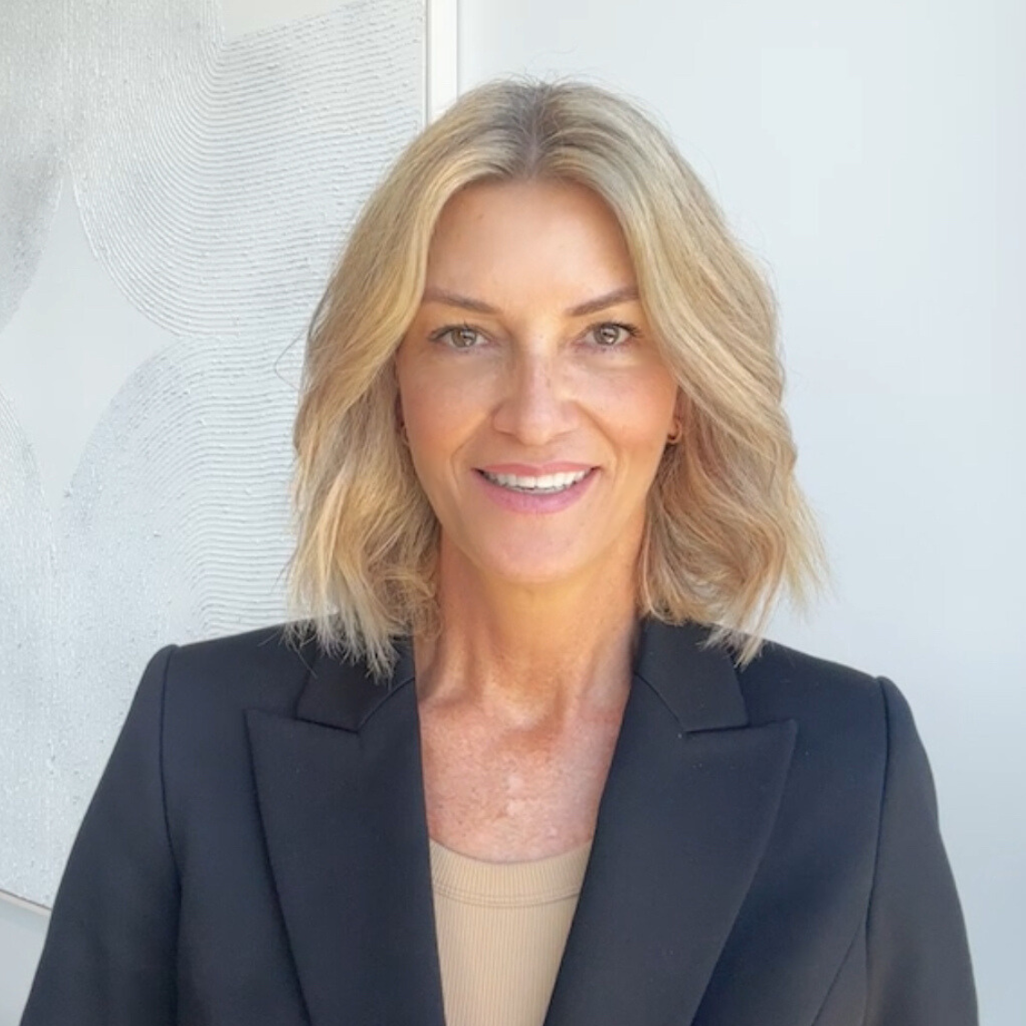 Tereza Murray, founder of Coralliance, wearing a black blazer in a professional setting.